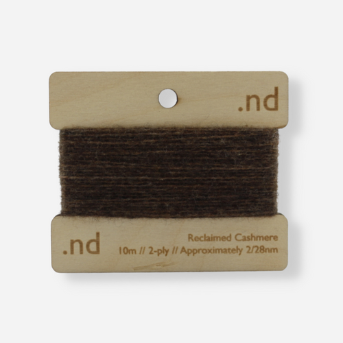 Brown reclaimed / recycled 100% cashmere mending yarn. 10m wound horizontally onto bespoke laser cut and branded ply. Approximately 2/28nm. perfect weight for visible and invisible mending, darning and Swiss darning knitwear repairs. Made by Second Cashmere at Bawn Glasgow