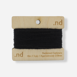 Black  reclaimed / recycled 100% cashmere mending yarn. 10m wound horizontally onto bespoke laser cut and branded ply. Approximately 2/28nm. perfect weight for visible and invisible mending, darning and Swiss darning knitwear repairs. Made by Second Cashmere at Bawn Glasgow