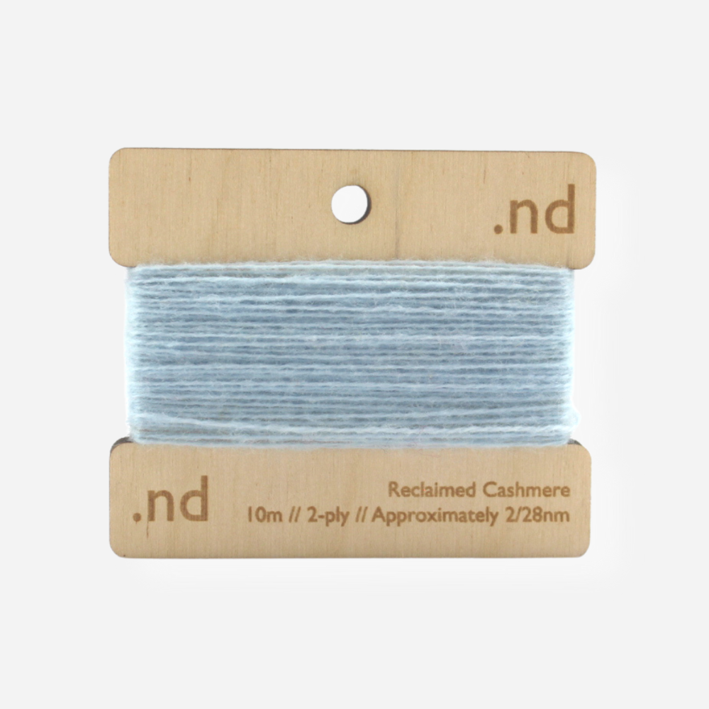 Light Blue reclaimed / recycled 100% cashmere mending yarn. 10m wound horizontally onto bespoke laser cut and branded ply. Approximately 2/28nm. perfect weight for visible and invisible mending, darning and Swiss darning knitwear repairs. Made by Second Cashmere at Bawn Glasgow