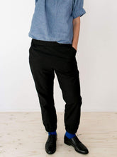 Load image into Gallery viewer, The Assembly Line Sewing Pattern. Model Wearing Almost Long Trousers