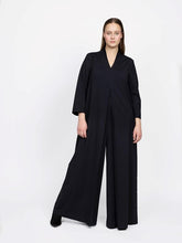 Load image into Gallery viewer, The Assembly Line Sewing Pattern. Model Wearing Maxi Jumpsuit