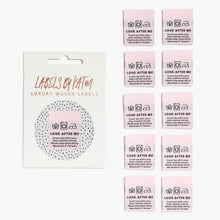 Load image into Gallery viewer, Flat Lay Kylie and the Machine Labels on white background - multiple colourful labels in paper sleeve saying: Look After Me
