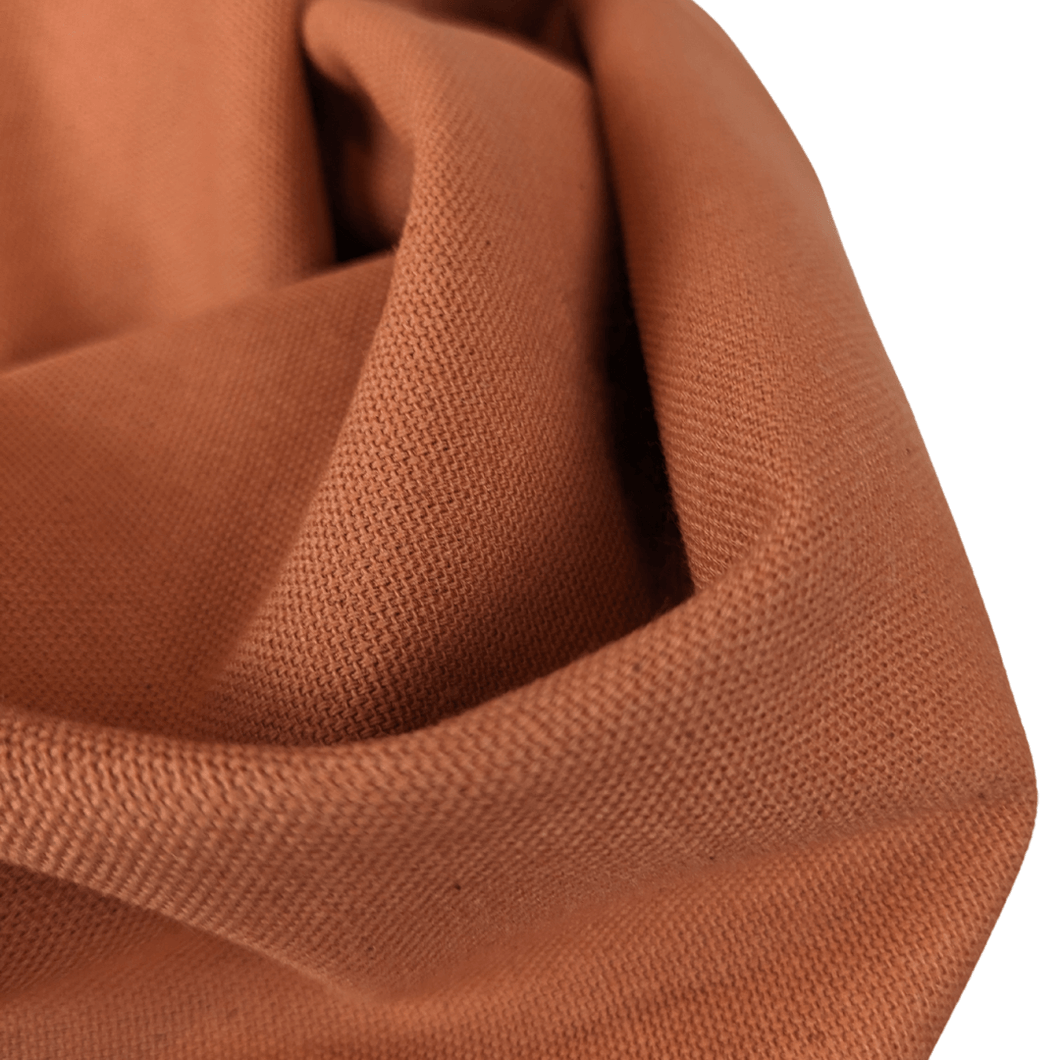 Lightweight cotton canvas fabric draped view orange colour