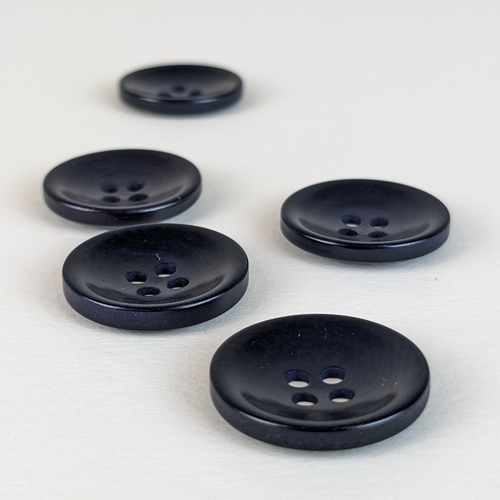 21mm four hole navy corozo buttons on white background
