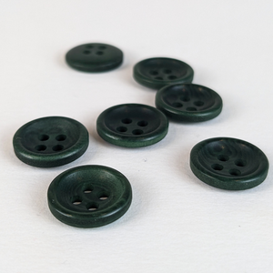 12mm four hole dark green corozo buttons on white background