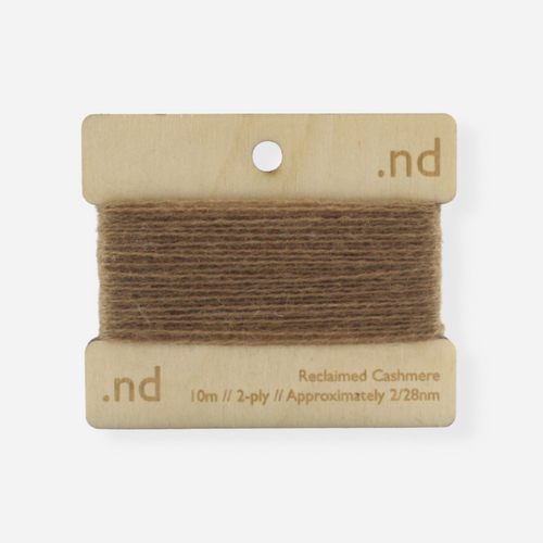 Dark Camel reclaimed / recycled 100% cashmere mending yarn. 10m wound horizontally onto bespoke laser cut and branded ply. Approximately 2/28nm. perfect weight for visible and invisible mending, darning and Swiss darning knitwear repairs. Made by Second Cashmere at Bawn Glasgow
