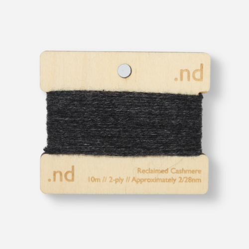 Dark Grey reclaimed / recycled 100% cashmere mending yarn. 10m wound horizontally onto bespoke laser cut and branded ply. Approximately 2/28nm. perfect weight for visible and invisible mending, darning and Swiss darning knitwear repairs. Made by Second Cashmere at Bawn Glasgow