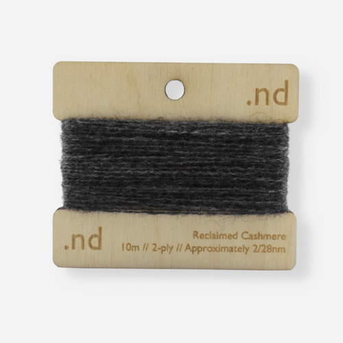 Grey reclaimed / recycled 100% cashmere mending yarn. 10m wound horizontally onto bespoke laser cut and branded ply. Approximately 2/28nm. perfect weight for visible and invisible mending, darning and Swiss darning knitwear repairs. Made by Second Cashmere at Bawn Glasgow