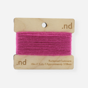 Barbie Bright Hot Pink reclaimed / recycled 100% cashmere mending yarn. 10m wound horizontally onto bespoke laser cut and branded ply. Approximately 2/28nm. perfect weight for visible and invisible mending, darning and Swiss darning knitwear repairs. Made by Second Cashmere at Bawn Glasgow