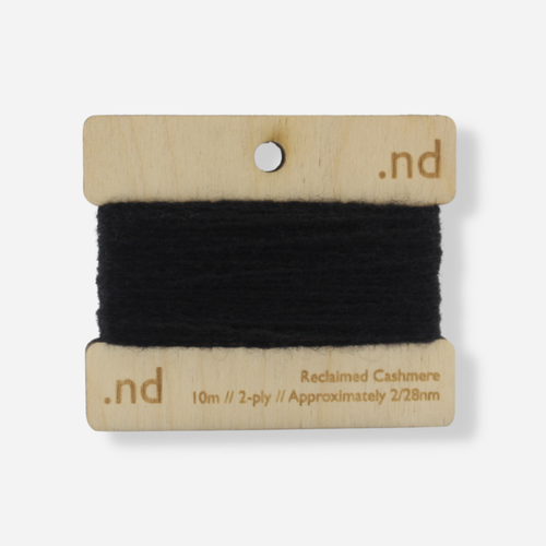 Black  reclaimed / recycled 100% cashmere mending yarn. 10m wound horizontally onto bespoke laser cut and branded ply. Approximately 2/28nm. perfect weight for visible and invisible mending, darning and Swiss darning knitwear repairs. Made by Second Cashmere at Bawn Glasgow