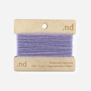 Lilac reclaimed / recycled 100% cashmere mending yarn. 10m wound horizontally onto bespoke laser cut and branded ply. Approximately 2/28nm. perfect weight for visible and invisible mending, darning and Swiss darning knitwear repairs. Made by Second Cashmere at Bawn Glasgow