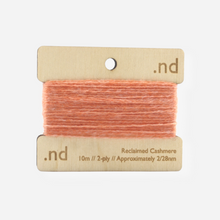 Load image into Gallery viewer, Peach reclaimed / recycled 100% cashmere mending yarn. 10m wound horizontally onto bespoke laser cut and branded ply. Approximately 2/28nm. perfect weight for visible and invisible mending, darning and Swiss darning knitwear repairs. Made by Second Cashmere at Bawn Glasgow
