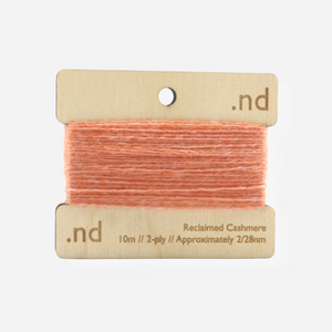 Peach reclaimed / recycled 100% cashmere mending yarn. 10m wound horizontally onto bespoke laser cut and branded ply. Approximately 2/28nm. perfect weight for visible and invisible mending, darning and Swiss darning knitwear repairs. Made by Second Cashmere at Bawn Glasgow