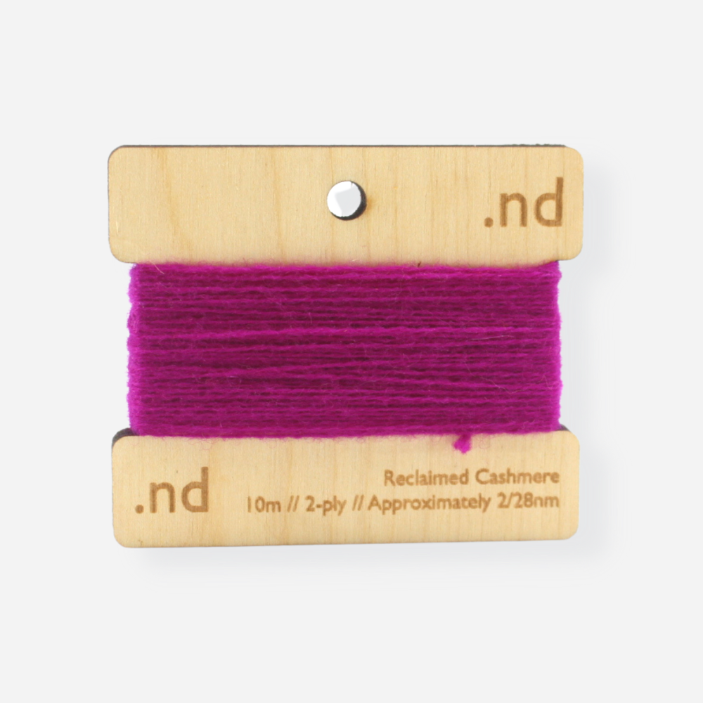 Fuchsia Pink reclaimed / recycled 100% cashmere mending yarn. 10m wound horizontally onto bespoke laser cut and branded ply. Approximately 2/28nm. perfect weight for visible and invisible mending, darning and Swiss darning knitwear repairs. Made by Second Cashmere at Bawn Glasgow