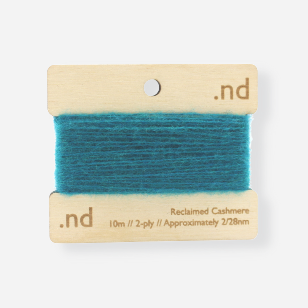 Teal reclaimed / recycled 100% cashmere mending yarn. 10m wound horizontally onto bespoke laser cut and branded ply. Approximately 2/28nm. perfect weight for visible and invisible mending, darning and Swiss darning knitwear repairs. Made by Second Cashmere at Bawn Glasgow