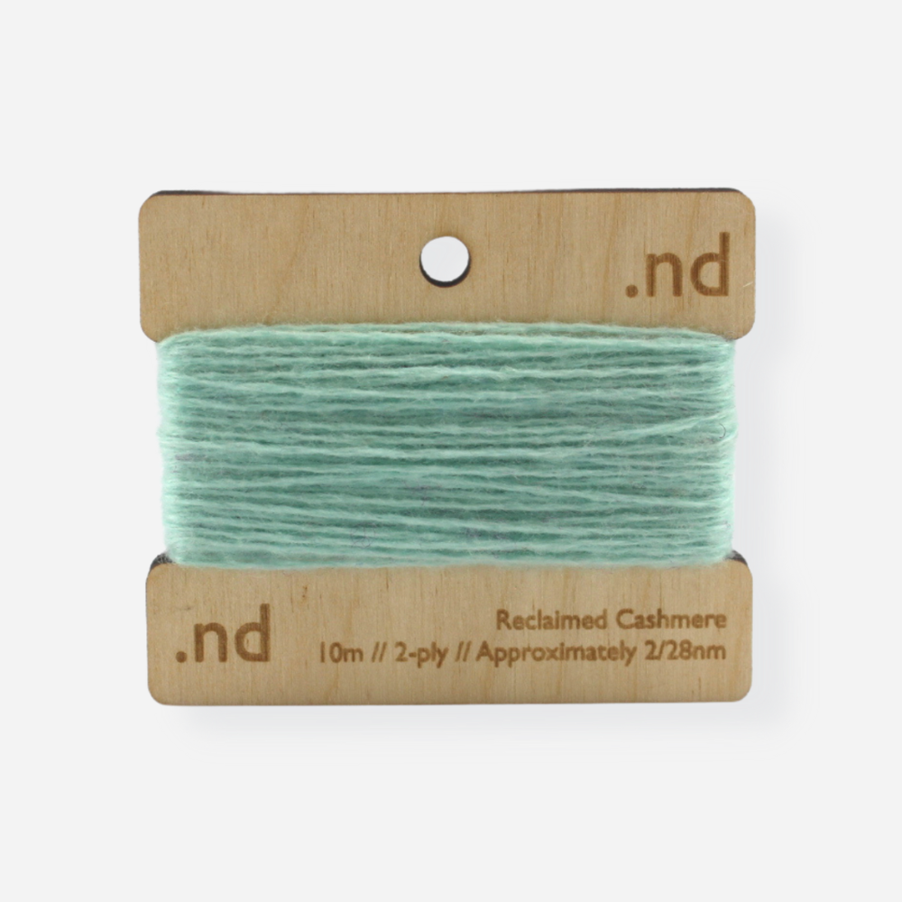 Mint green  reclaimed / recycled 100% cashmere mending yarn. 10m wound horizontally onto bespoke laser cut and branded ply. Approximately 2/28nm. perfect weight for visible and invisible mending, darning and Swiss darning knitwear repairs. Made by Second Cashmere at Bawn Glasgow