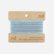 Load image into Gallery viewer, Light Blue reclaimed / recycled 100% cashmere mending yarn. 10m wound horizontally onto bespoke laser cut and branded ply. Approximately 2/28nm. perfect weight for visible and invisible mending, darning and Swiss darning knitwear repairs. Made by Second Cashmere at Bawn Glasgow
