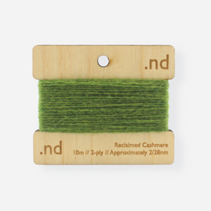 Green  reclaimed / recycled 100% cashmere mending yarn. 10m wound horizontally onto bespoke laser cut and branded ply. Approximately 2/28nm. perfect weight for visible and invisible mending, darning and Swiss darning knitwear repairs. Made by Second Cashmere at Bawn Glasgow
