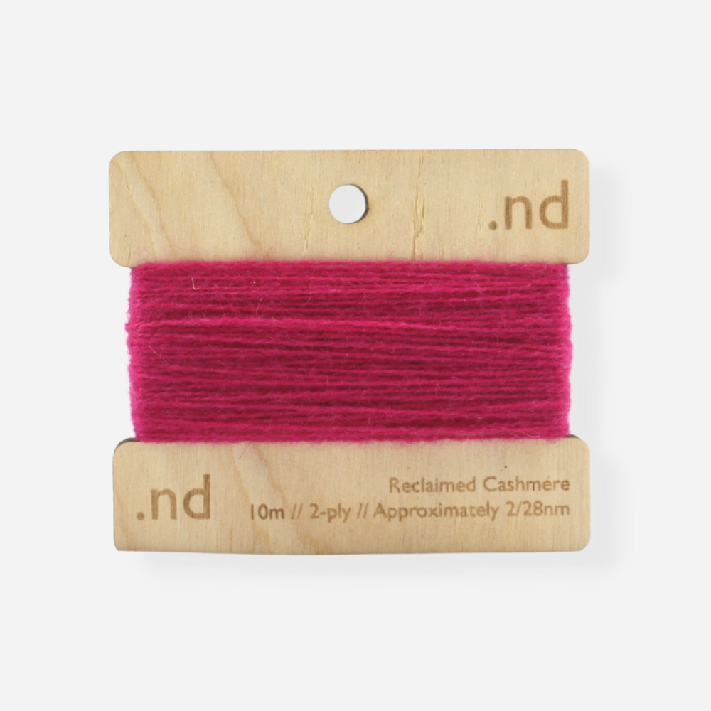 Bright Hot Pink reclaimed / recycled 100% cashmere mending yarn. 10m wound horizontally onto bespoke laser cut and branded ply. Approximately 2/28nm. perfect weight for visible and invisible mending, darning and Swiss darning knitwear repairs. Made by Second Cashmere at Bawn Glasgow