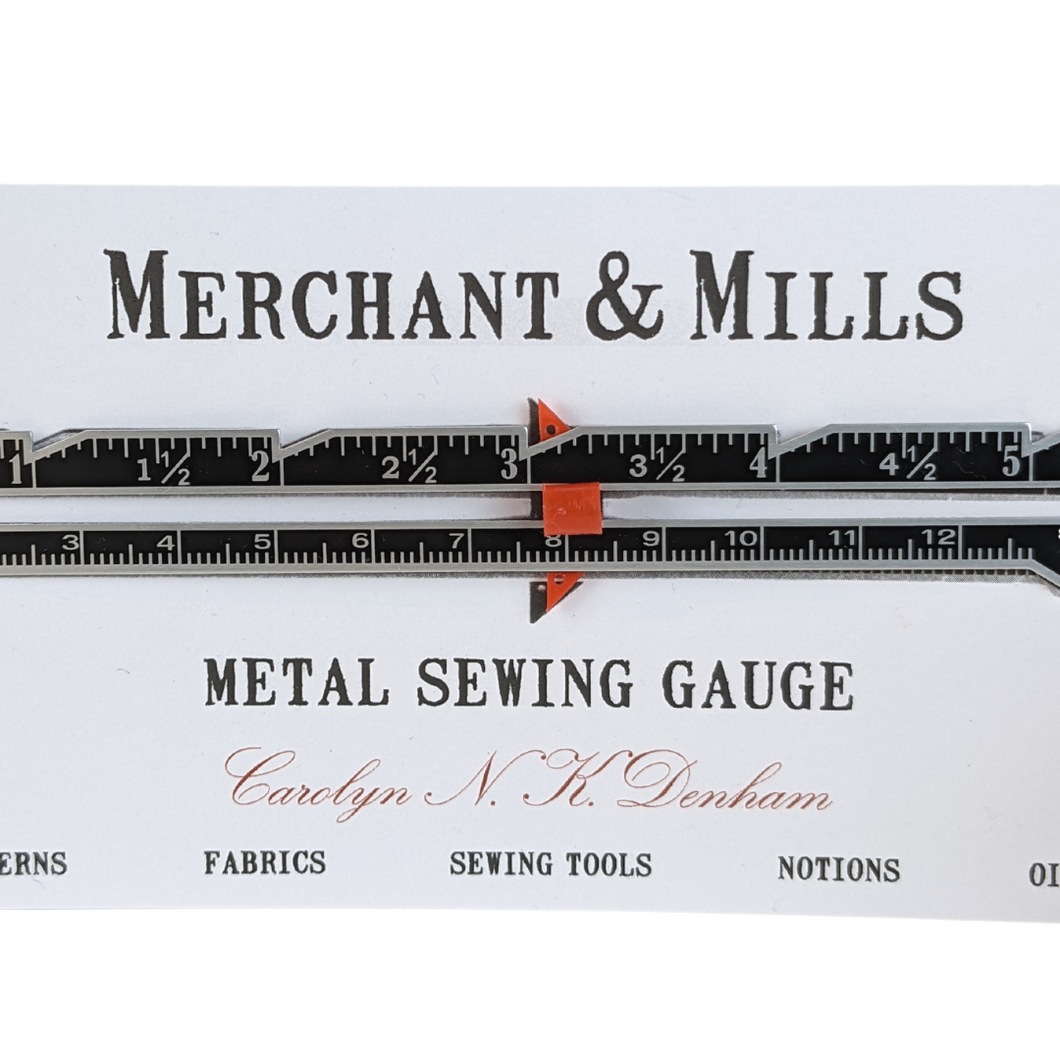 Metal sewing guage. Sewing Tools. Sewing Notions.  Used for measuring hems, checking seam allowance. It features a red                                 sliding pointer for stitching consistency. Sustainable Haberdashery. Glasgow. 