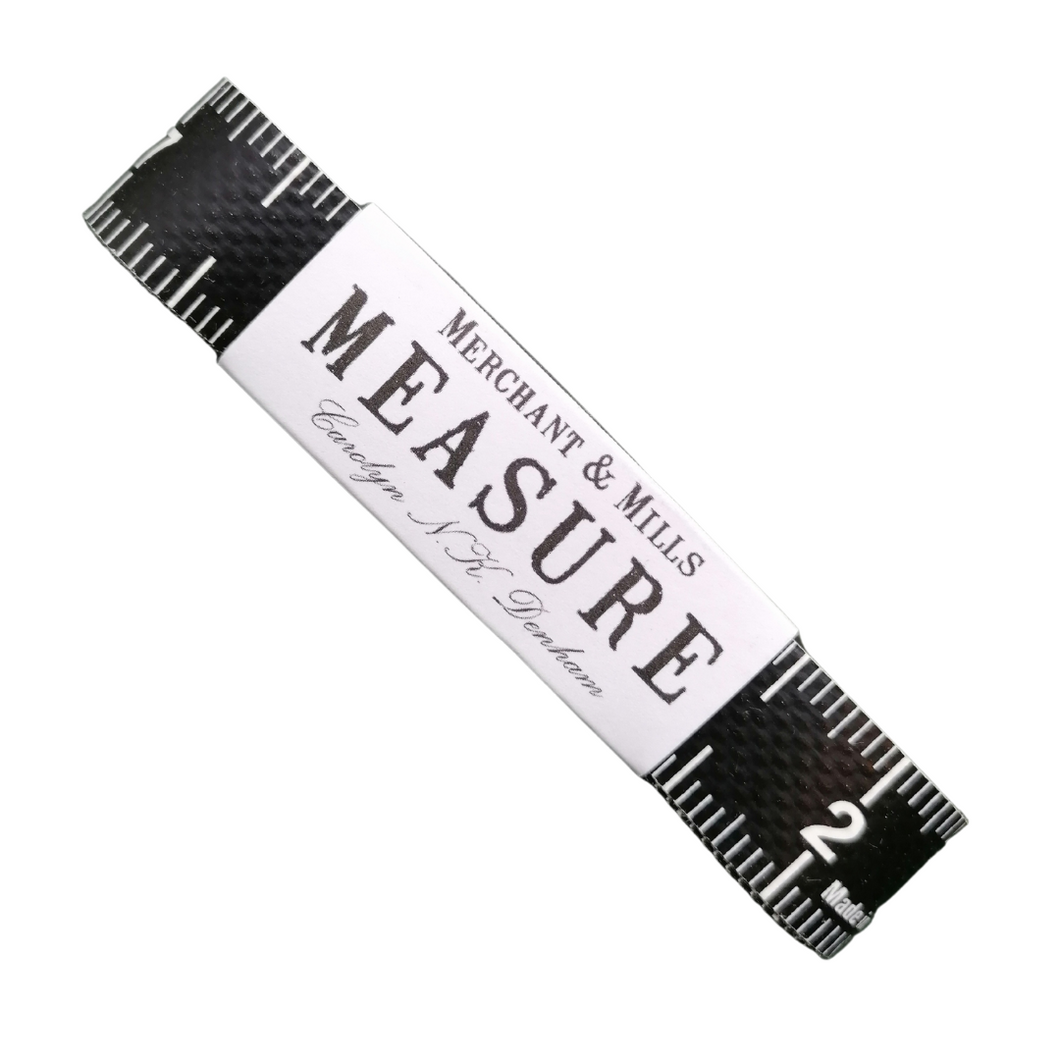 Black and White tape measure by Merchant and Mills. Monochrome dressmaking flexible tape measure, centimetres and inches. 