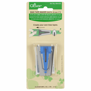Metal and blue plastic gadget for making 25mm bias binding tape by Clover. In branded green packaging