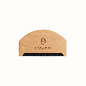 Socko Pilling comb for debobbling your knitwear. care for cashmere. clothing care. wooden handle clothing comb. white background flat lay. 