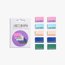 Load image into Gallery viewer, Flat Lay Kylie and the Machine Labels on white background - multiple colourful labels in paper sleeve saying:  It has Pockets

