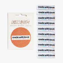 Load image into Gallery viewer, Flat Lay Kylie and the Machine Labels on white background - multiple colourful labels in paper sleeve saying:  Made with Love and Swear Words
