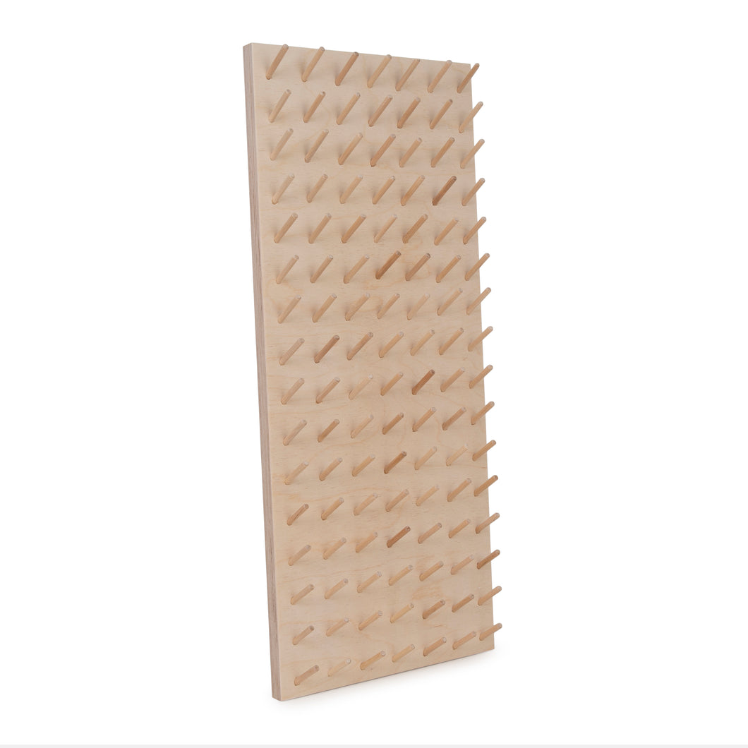 Large birch ply peg board for thread storage. Made by Laura ter Kuile for Bawn Textiles. 