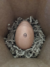 Load image into Gallery viewer, Socko mending egg in nest of recycled packaging paper shreds. Socko mending egg. Wooden Darning egg. White background. Sustainable Haberdashery. Sewing tools. Swiss darning. Mending. Glasgow
