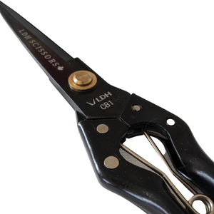 Sprung handle batting fabric shears in black, branded with LDH company logo. Locked and closed diagonal lay