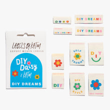 Load image into Gallery viewer, Flat Lay Kylie and the Machine Labels on white background - multiple colourful labels in paper sleeve in collaboration with DIY Daisy
