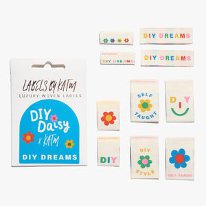 Flat Lay Kylie and the Machine Labels on white background - multiple colourful labels in paper sleeve in collaboration with DIY Daisy